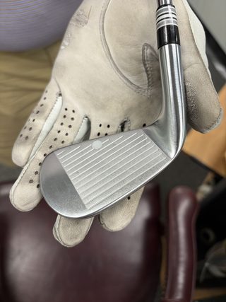 Iron in hand at the fitting bay